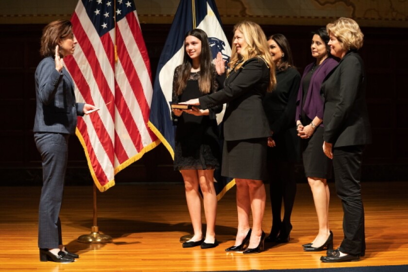 Kathi Vidal being ceremonially sworn in by commerce secretary Gina Raimondo