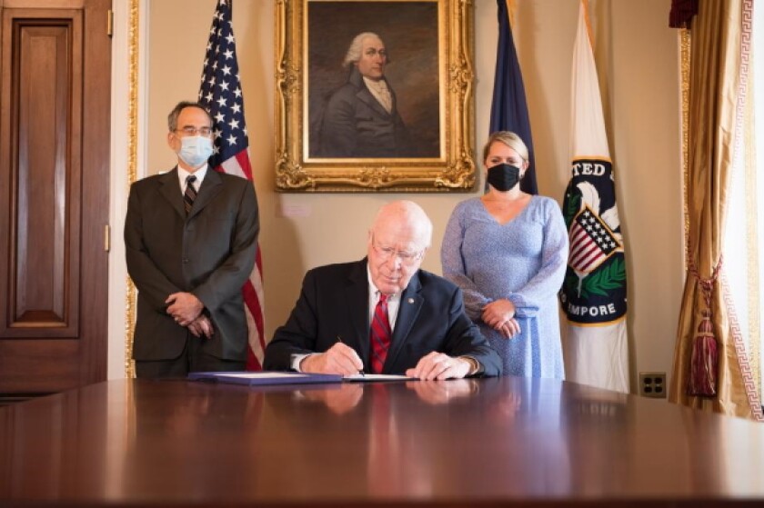 Senator Patrick Leahy signing the Bipartisan Emergency Capitol Security Appropriations Act, dated July 30