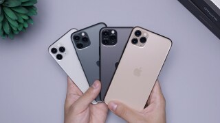 Four iPhones being held in a 'fan'