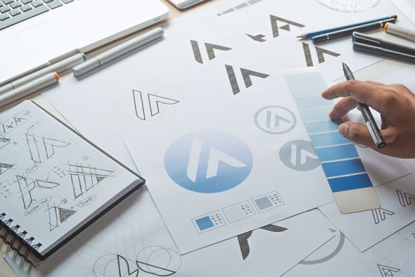 Graphic designer development process drawing sketch design creative Ideas draft Logo product trademark label brand artwork. Graphic designer studio Concept.