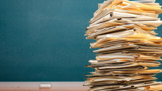 Stack file folders with documents on the desk