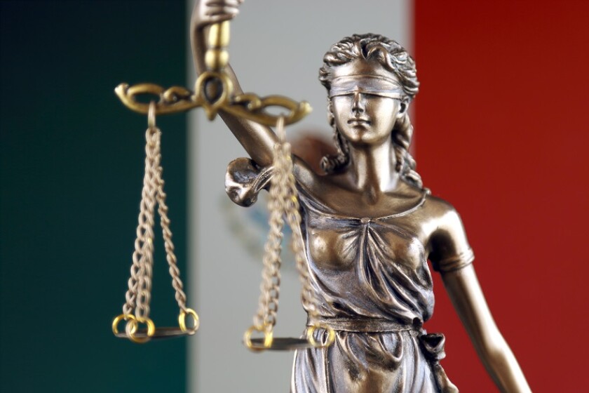 Symbol of law and justice with Mexico Flag. Close up.
