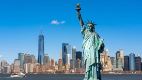 The Statue of Liberty over the Scene of New york cityscape river