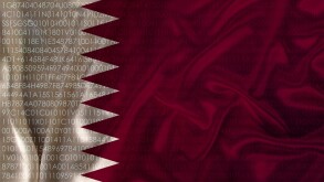 photo of the beautiful colored national flag of the modern state of Qatar on a textured fabric, concept of tourism, emigration, economy and politics, closeup