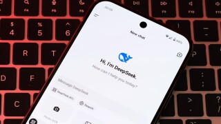 DeepSeek AI interface is seen on the smartphone placed on laptop keyboard. Concept for a new chat bot, competitor to Chat GPT. Stafford, United Kingdom, January 26, 2025