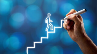 Confident businessman climbing drawn staircase to success, career promotion and business growth concept, hand drawing steps, financial chart, profit progress and market strategy