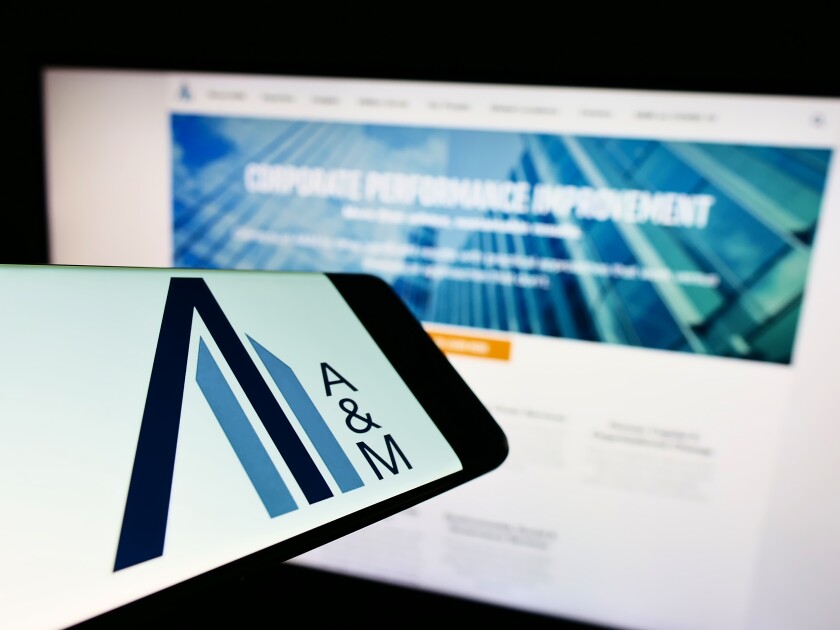 Stuttgart, Germany - 06-19-2022: Cellphone with logo of American consulting company Alvarez and Marsal LLC on screen in front of website. Focus on center-right of phone display.