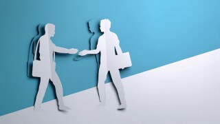 Paper Art - two Businessmen shaking hands On A Deal