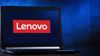 Laptop computer displaying logo of Lenovo