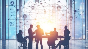 People in conference room and network