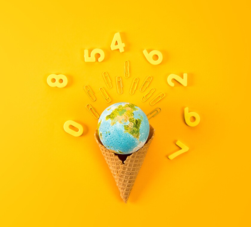 top view of earth globe in waffle cone surrounded with digits on