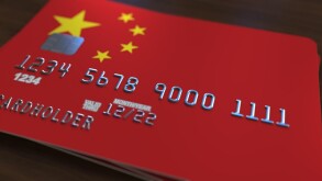 Plastic bank card featuring flag of China. National banking system related 3D rendering