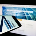 Stuttgart, Germany - 06-19-2022: Cellphone with logo of American consulting company Alvarez and Marsal LLC on screen in front of website. Focus on center-right of phone display.