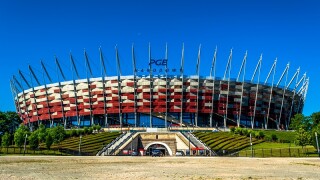 Warsaw, Poland – July 16, 2017: National football stadium of poland in Warsaw. Sunny summer day with a blue sky and green trees. Horizontal photo.