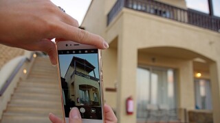 Women is taking pictures with her mobile phone