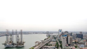 HIGH ANGLE VIEW OF BUILDINGS AND CITY AGAINST SKY