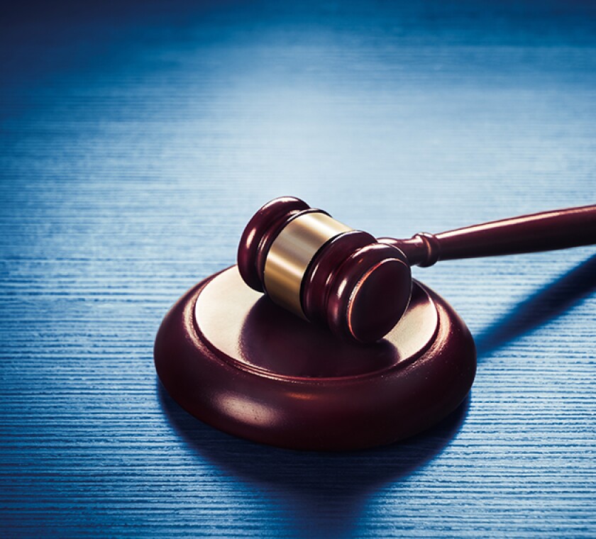 judge gavel on a blue wooden background