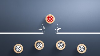 Target icon on wooden cube breaking through obstacle, Concept of overcoming barriers, goal