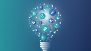 Medical symbols on lightbulb