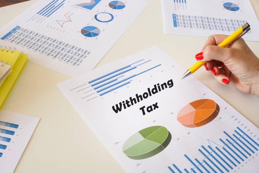 Banker present to the phrase Withholding Tax on the chart sheet.