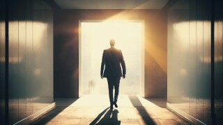 Businessman walking through the doorway, an open door filled with sunlight, enter the positive world.
