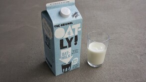 Portland, Oregon, USA - Sep 6, 2019: Oatly brand oak milk on grey background. Oatly is a Swedish oat drink company.