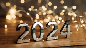 happy new year 2024 background new year holidays card with bright lights,gifts and bottle of hampagne