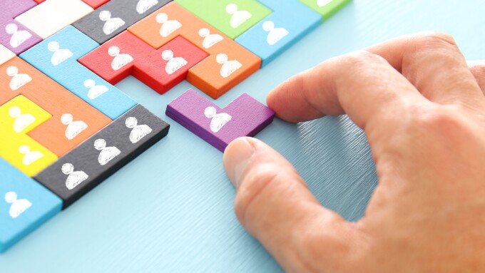 image of tangram puzzle blocks with people icons over wooden table ,human resources and management concept.