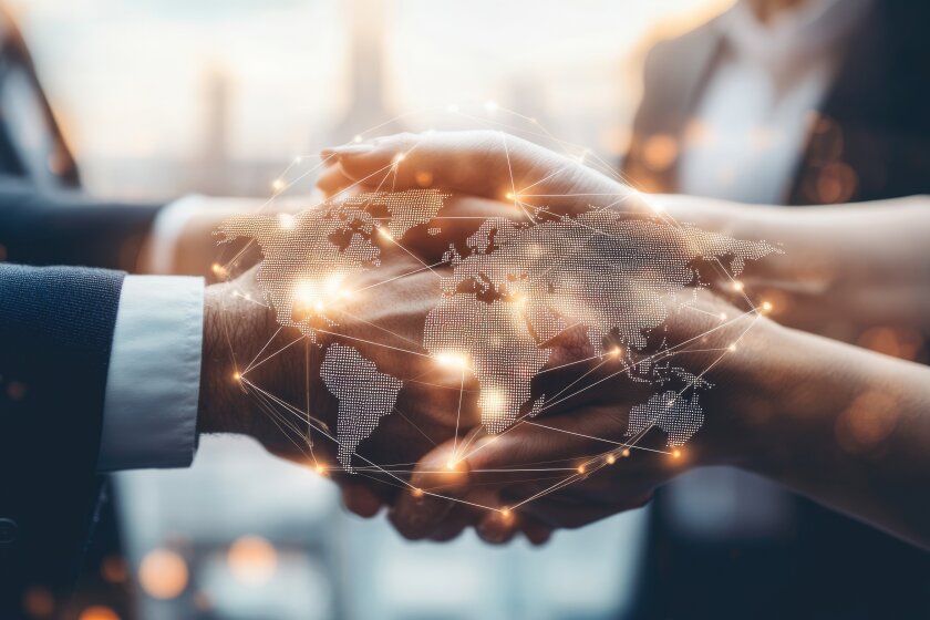 Map with connecting networks against a background of shaking hands