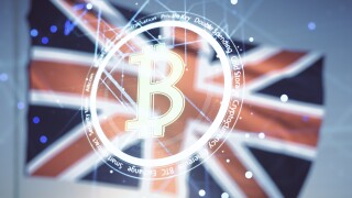 Virtual Bitcoin hologram on flag of Great Britain and sunset sky background. Multiexposure