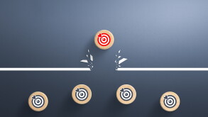 Target icon on wooden cube breaking through obstacle, Concept of overcoming barriers, goal