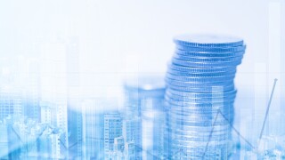 Double exposure of stacks of coins and account book or credit card with financial graph and city background, finance and business concept.