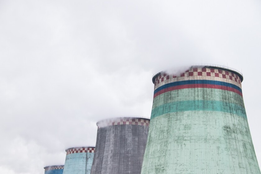 Smoke from the pipe of a thermal power plant. Smoke in the sky. Air pollution. Bad ecology.