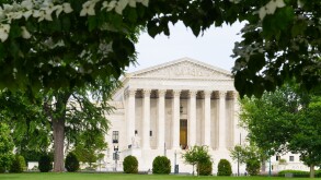 Supreme Court Building in the frame of green leaves - Washington