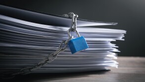 Documents locked with padlock and chains.