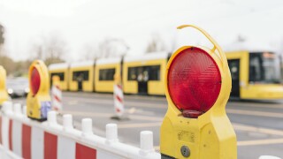 Close-Up Of Stop Light On Barricade In City
