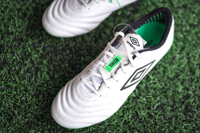 Thailand - 26 September 2023 : Umbro sport brand is release the new football shoe "Tocco III" which is design for control and touch performance which is made from soft leather. Close-up.