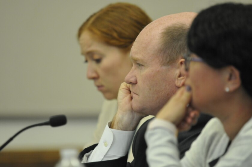 Chris Coons at a roundtable discussion with mental health stakeholders in 2018