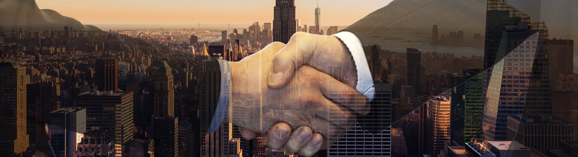 Handshake on city backdrop