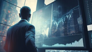 Finance trade manager analysing stock market indicators for best