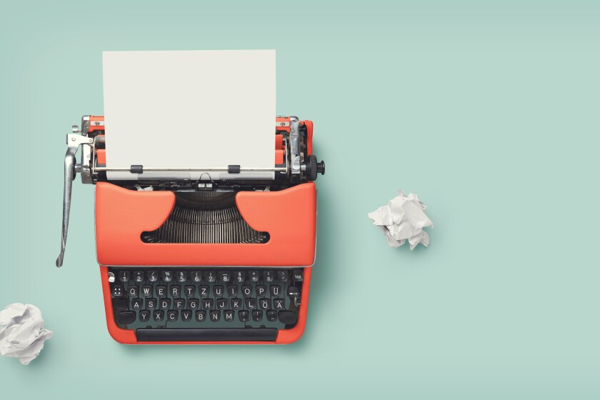 retro banner with red vintage typewriter with a blank sheet of p