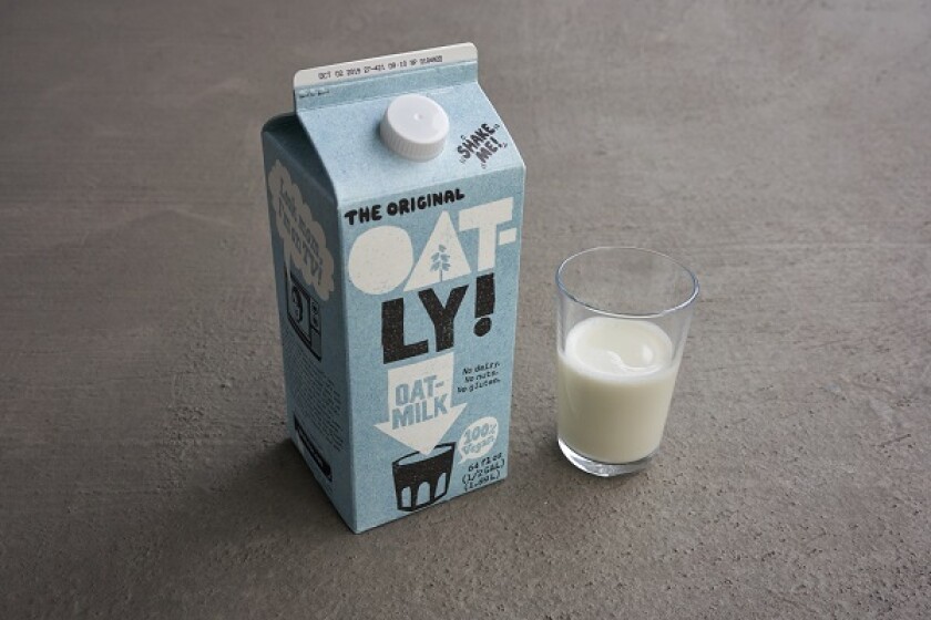 Portland, Oregon, USA - Sep 6, 2019: Oatly brand oak milk on grey background. Oatly is a Swedish oat drink company.