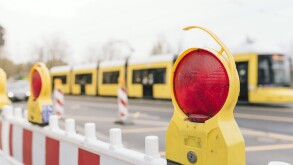 Close-Up Of Stop Light On Barricade In City