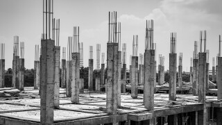 Columns under construction in Yangon outskirts, black and white image
