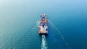 Aerial view of container cargo ship in sea.
