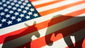 animal shadows on the flag. Democrats vs republicans are in ideological duel on the american flag. In American politics US parties are represented by either the democrat donkey or republican elephant