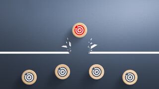 Target icon on wooden cube breaking through obstacle, Concept of overcoming barriers, goal