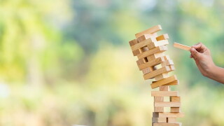 The jenga game ,tower stack from wooden blocks toy and  hand tak