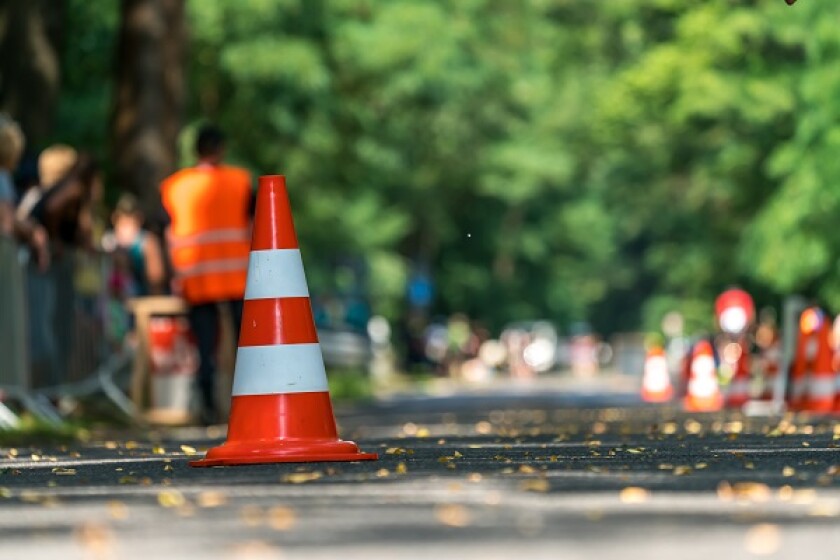 Traffic cone on a street as a warning sign