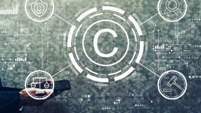 Copyright concept with businessman holding a tablet